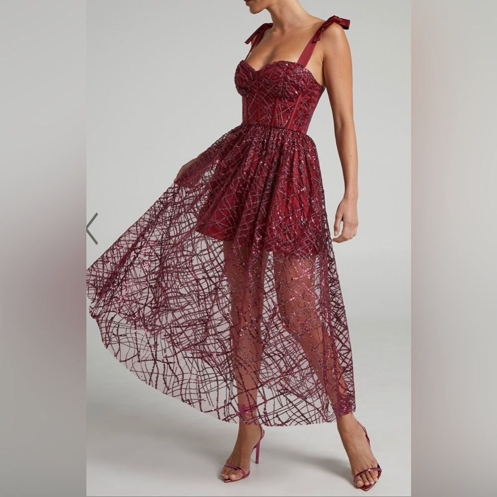 This dress is very elegant and unique. The dress is from Showpo. Berry color